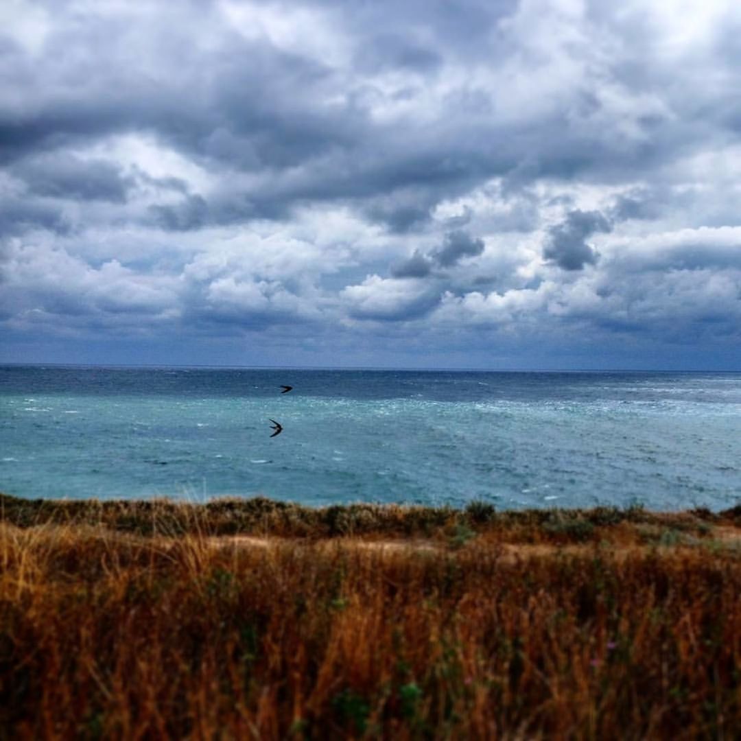 VIEW OF SEA AGAINST CLOUDY SKY