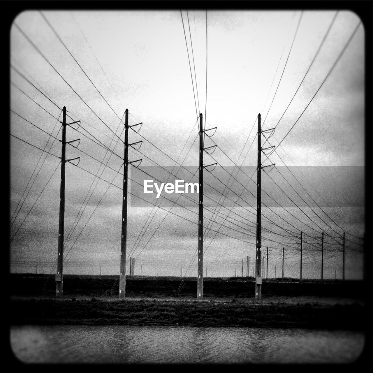 ELECTRICITY PYLONS AGAINST SKY