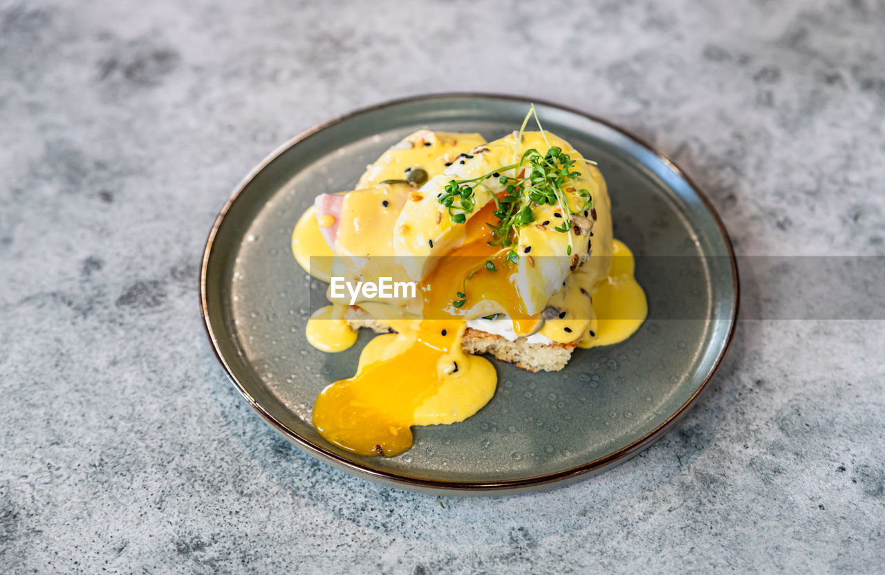 food and drink, food, egg, healthy eating, egg yolk, dish, freshness, yellow, wellbeing, meal, produce, no people, plate, plant, gray, fried, breakfast, fried egg, high angle view, indoors, studio shot