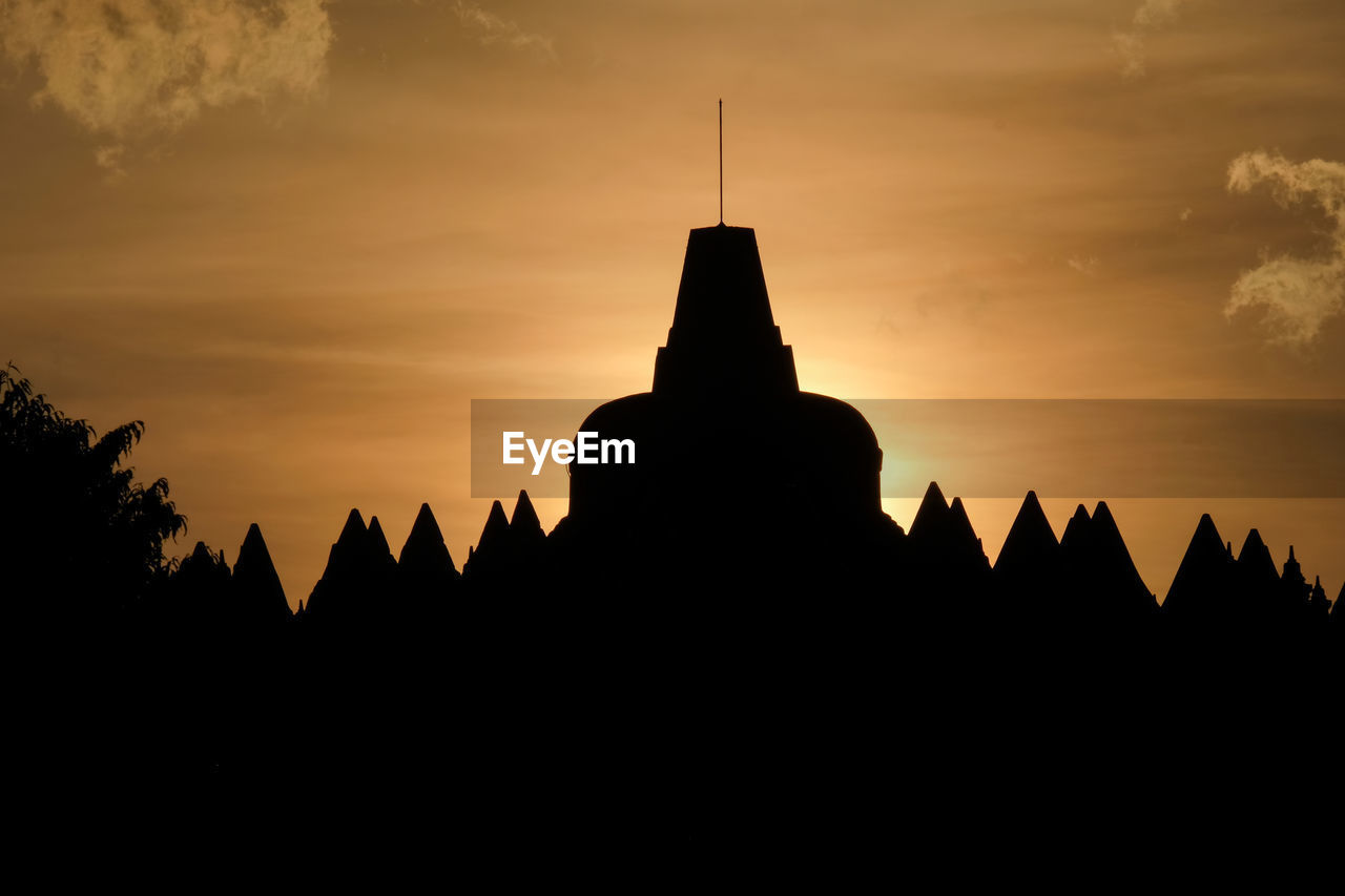 SILHOUETTE TEMPLE AGAINST SKY AT SUNSET