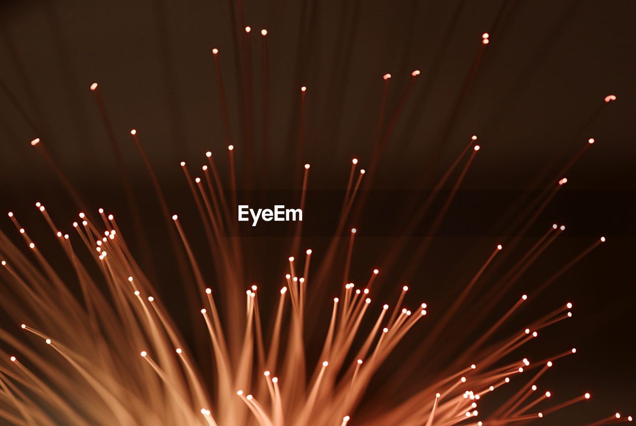 Close-up of glowing orange fiber optic