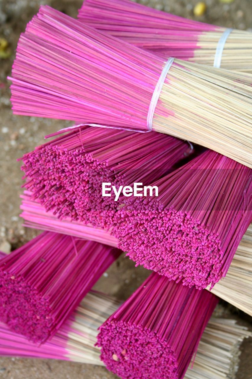 Close-up of pink scent sticks on table