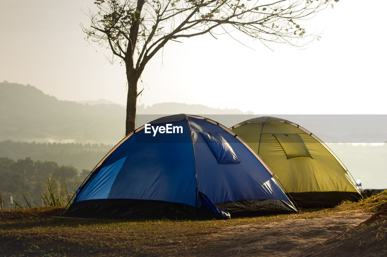 TENT ON LAND AGAINST SKY