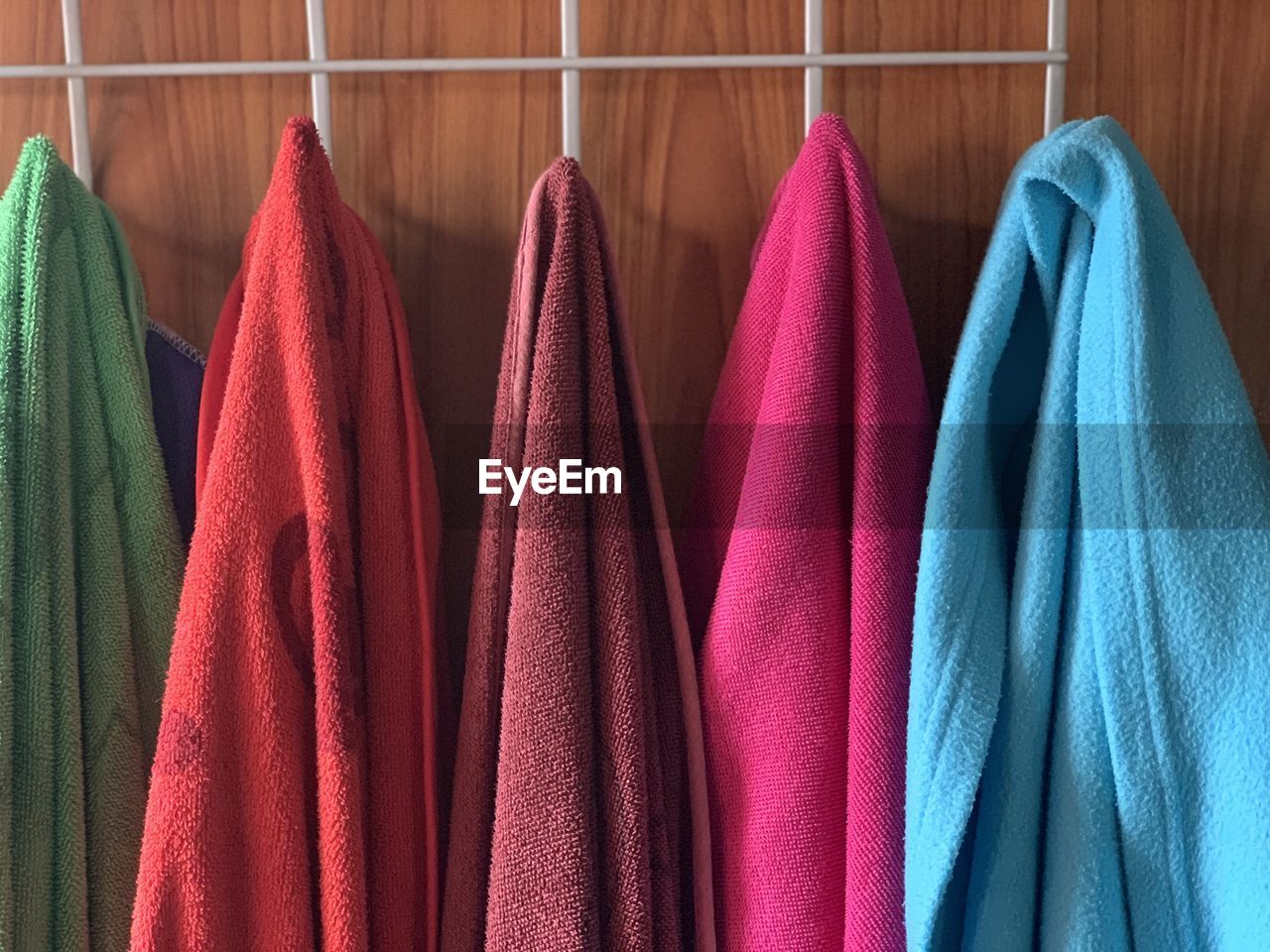 Colorful towels hanging on rack