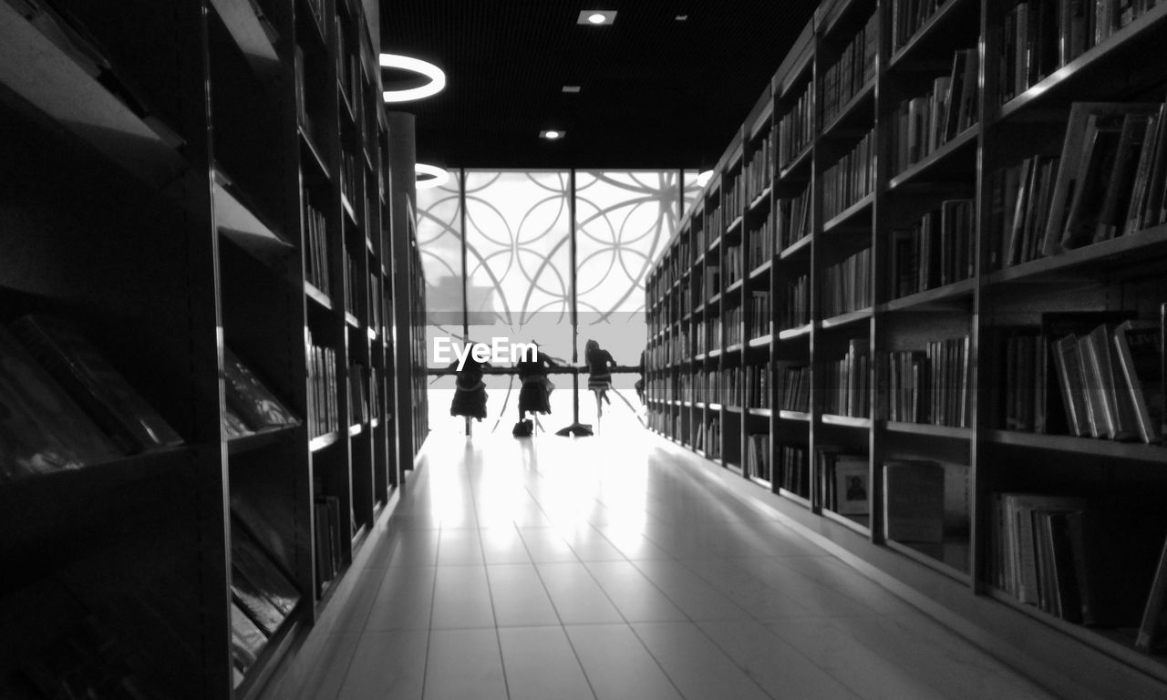 WOMAN WALKING IN CORRIDOR