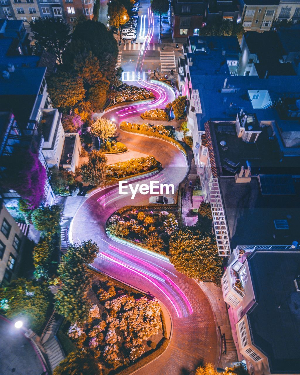 High angle view of light trails in city at night