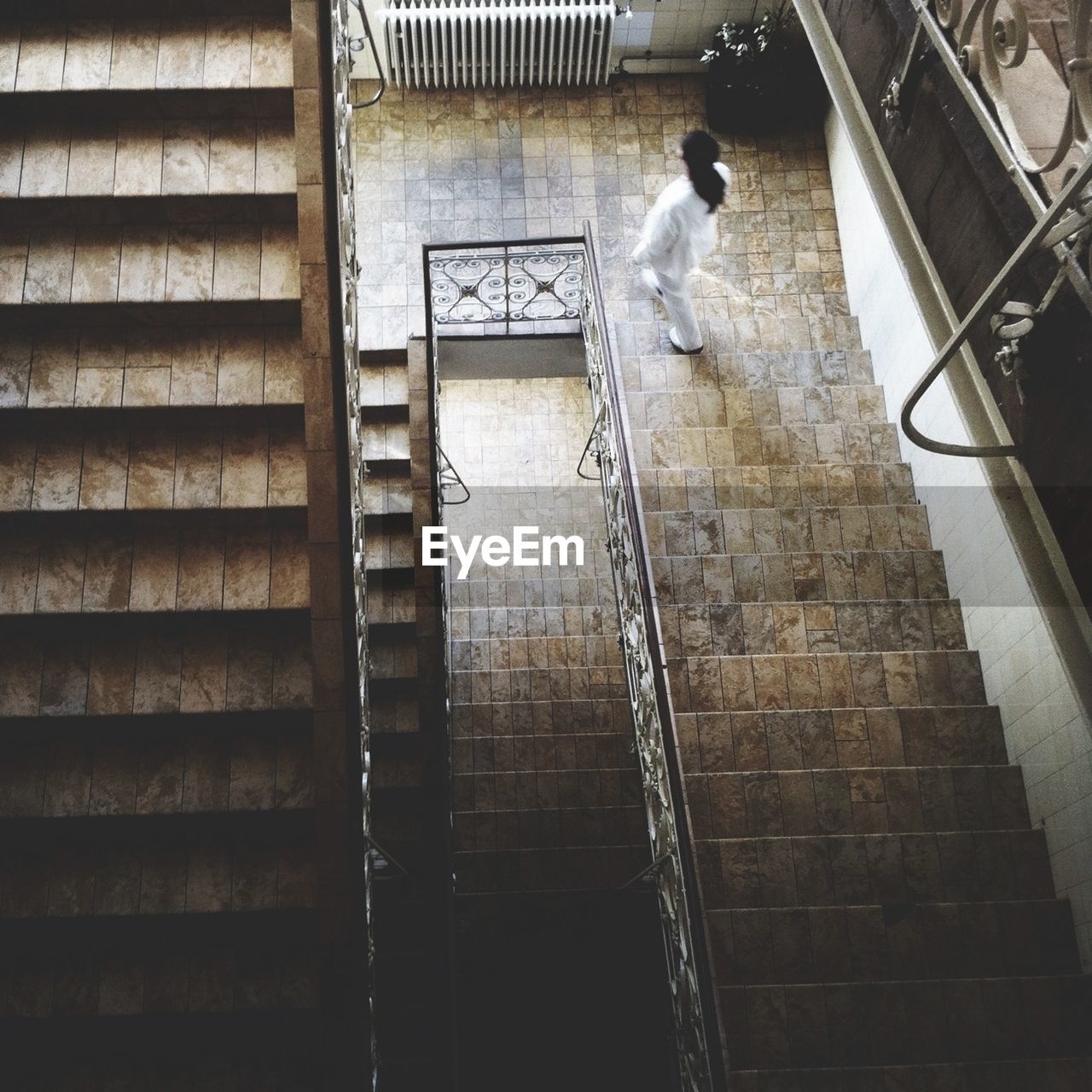 High angle view of woman on staircase