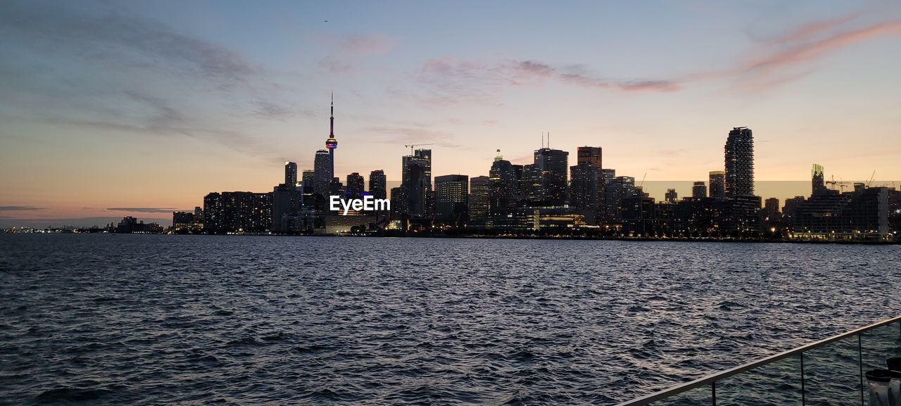 MODERN BUILDINGS IN CITY DURING SUNSET