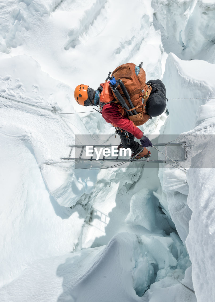 Nepal, solo khumbu, everest, sagamartha national park, mountaineer crossing icefall at western cwm