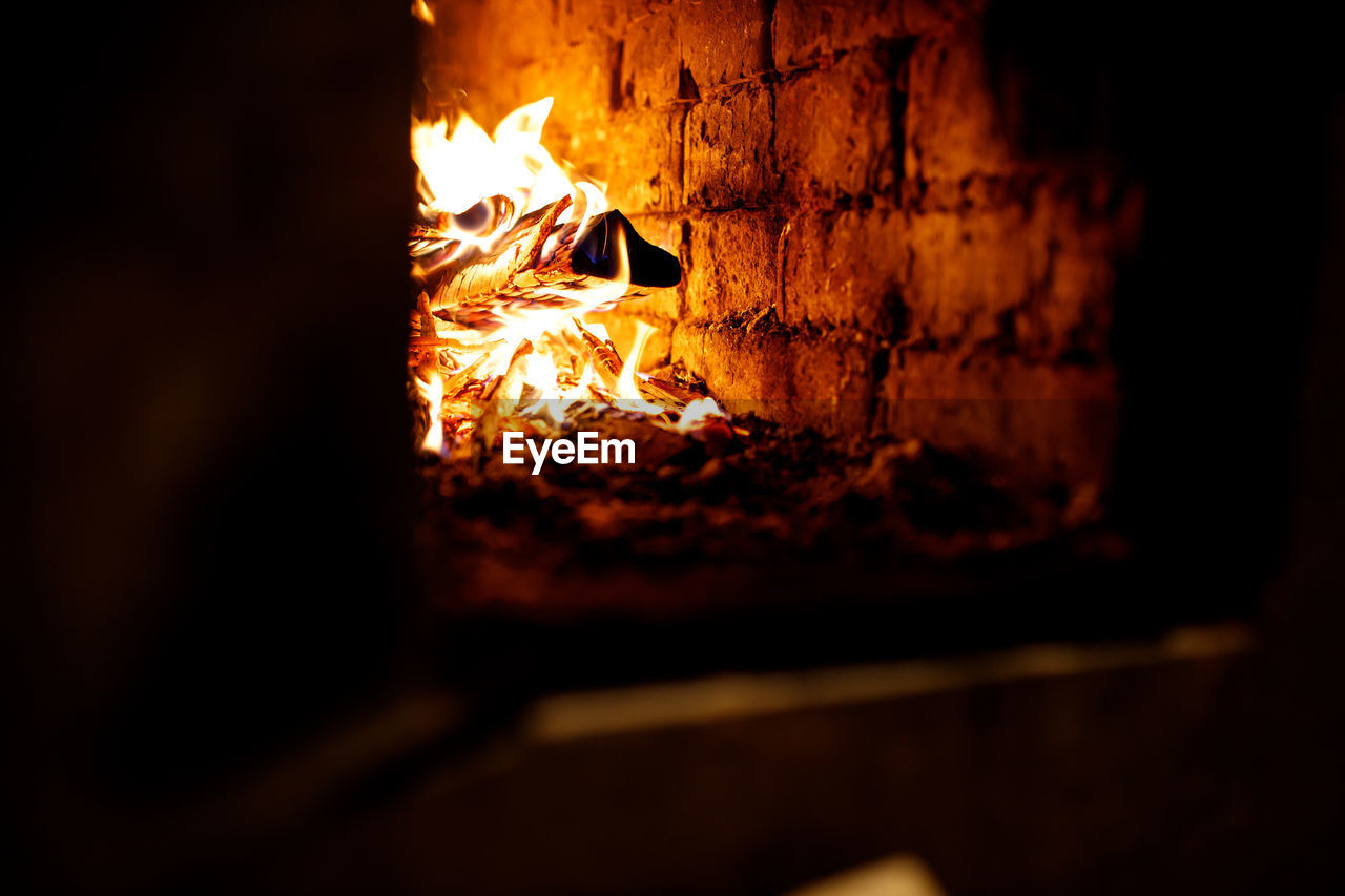 Fire in the fireplace. burning wood in a rustic stove