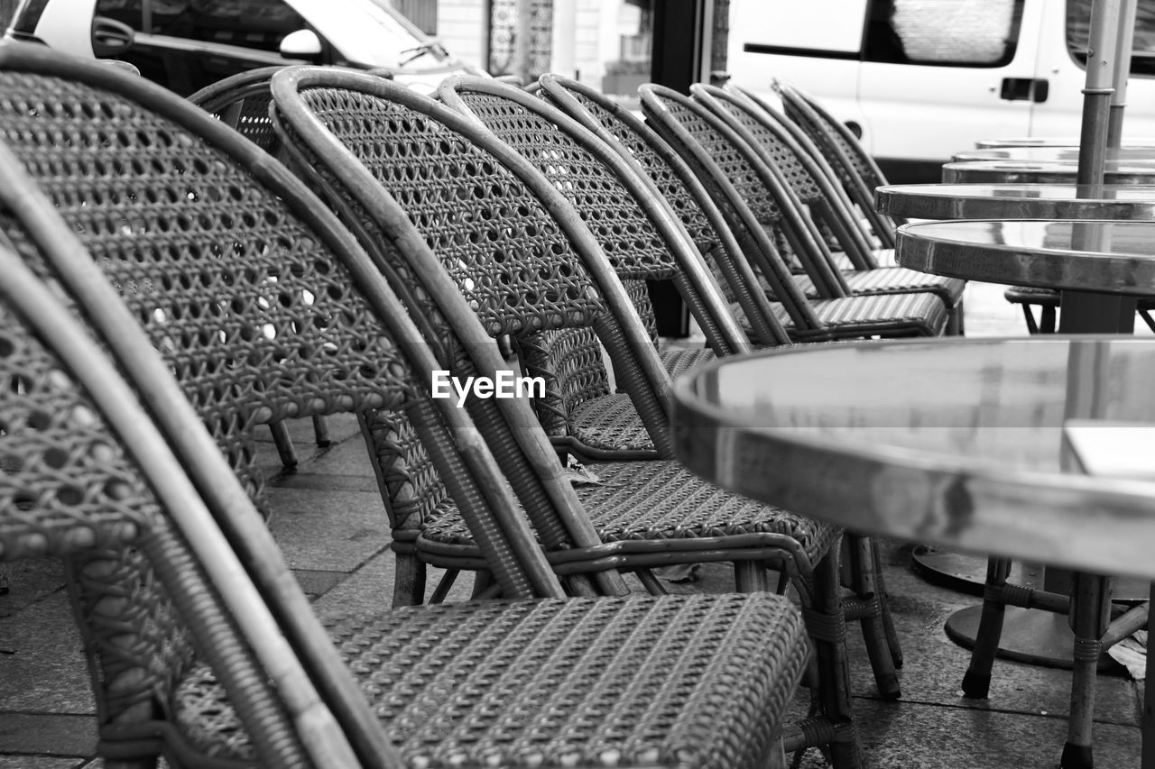 Close-up of chairs at cafe