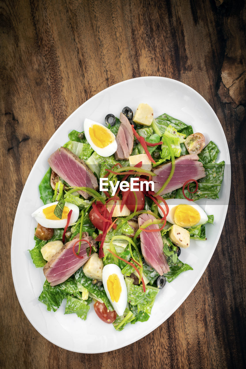 directly above shot of food served in plate on table