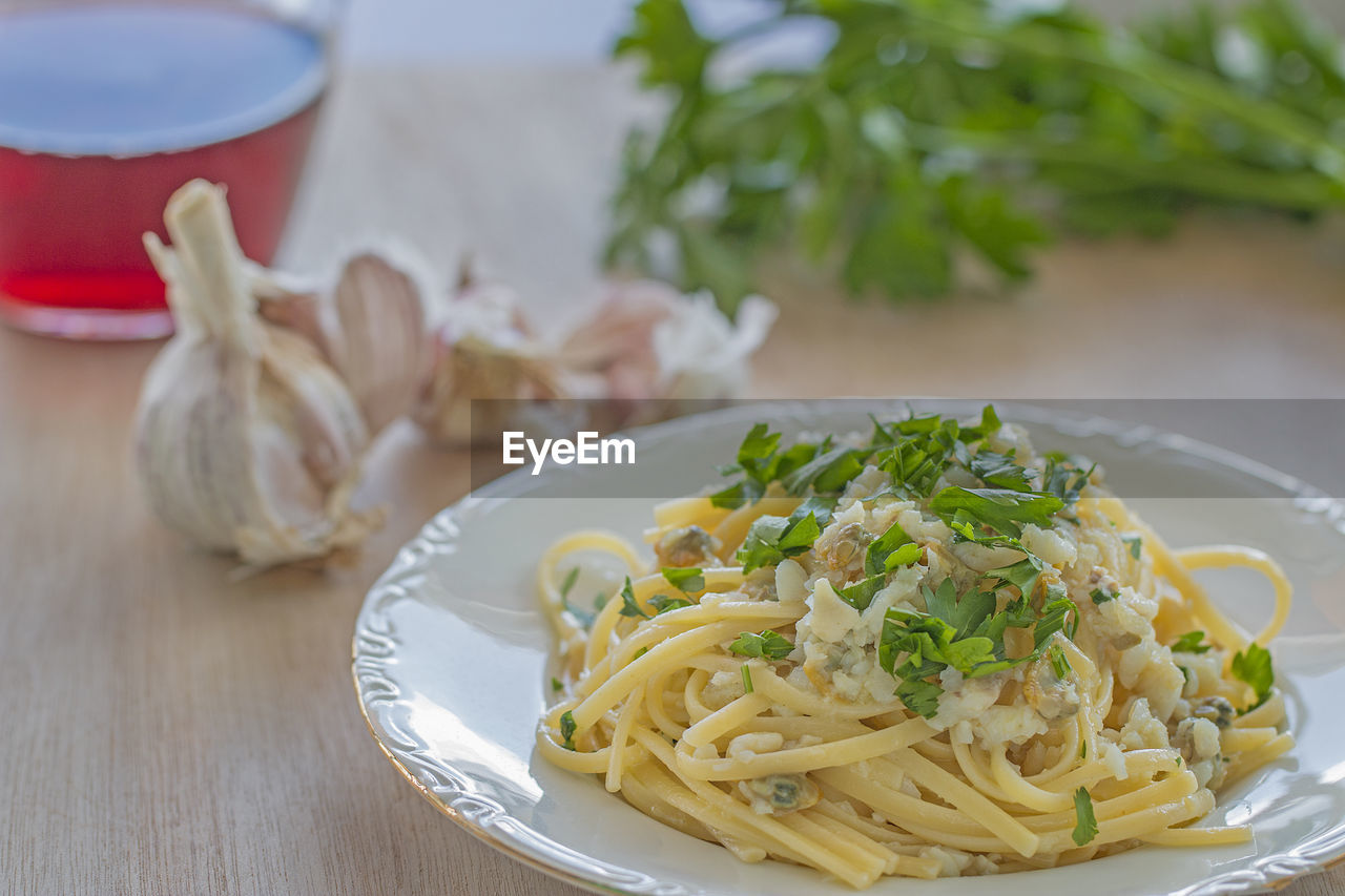 A dish with linguine pasta with fish.