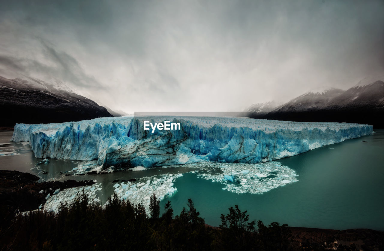 Scenic view of frozen lake against sky