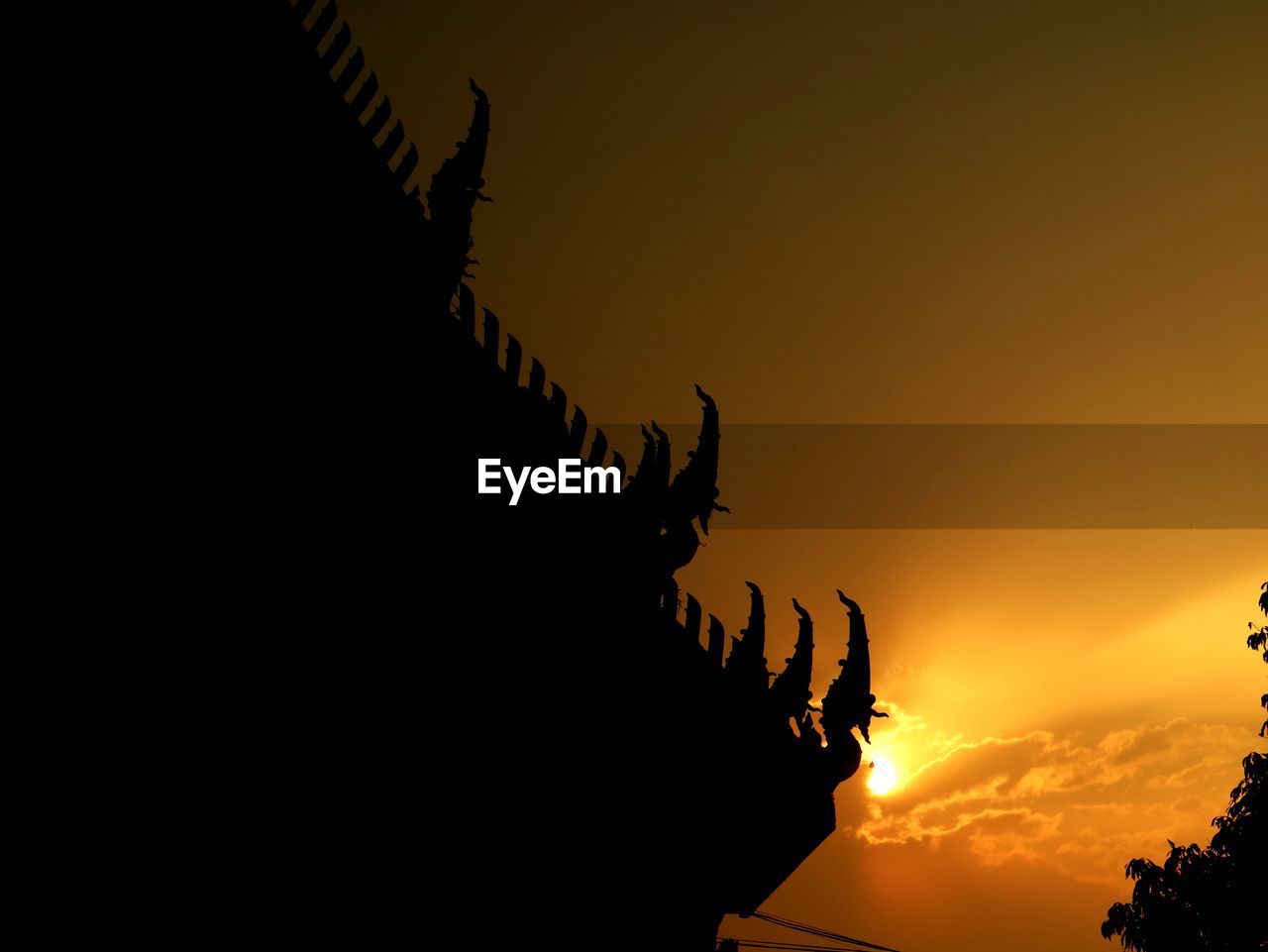 Low angle view of silhouette temple against sky during sunset