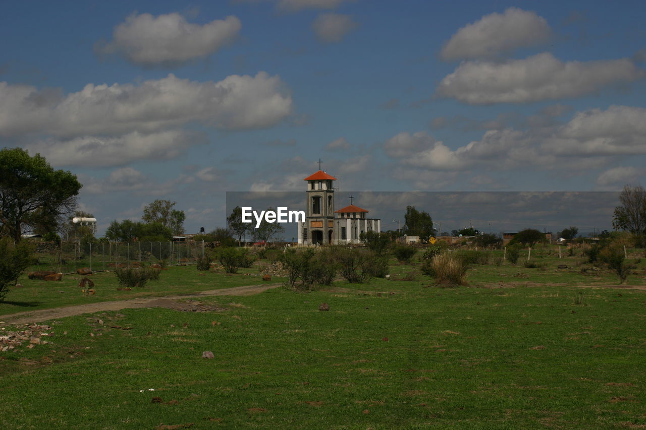 VIEW OF LANDSCAPE AGAINST CLOUDY SKY