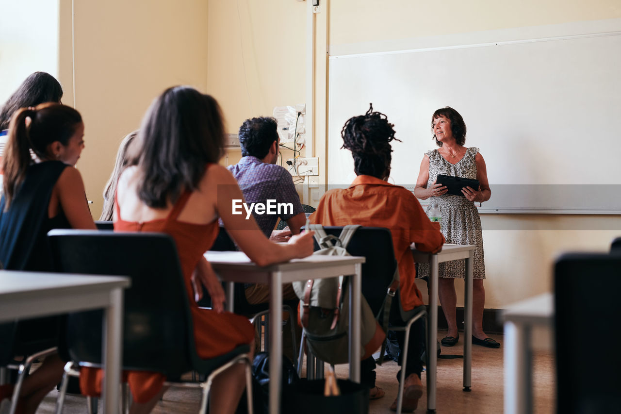 Teacher explaining to students in classroom