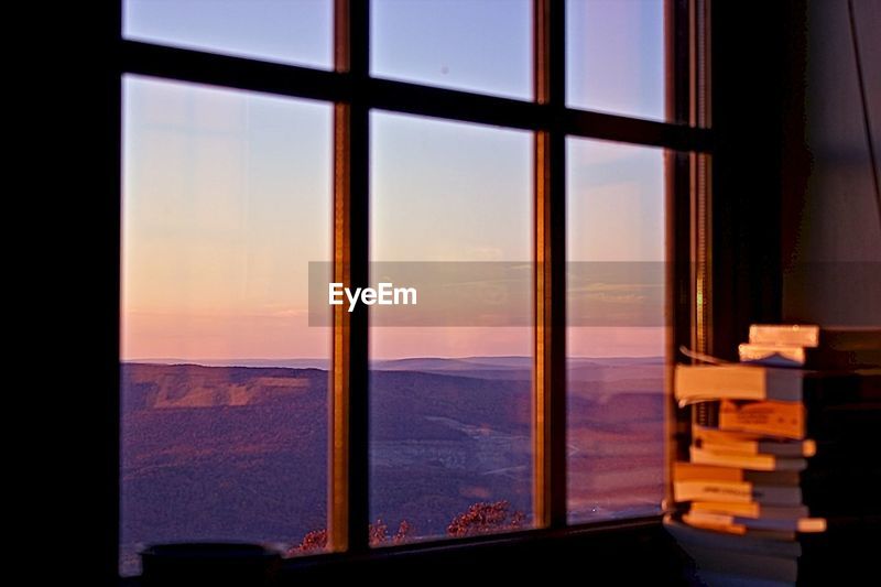 View Of Moutains Through Window At Sunset Id