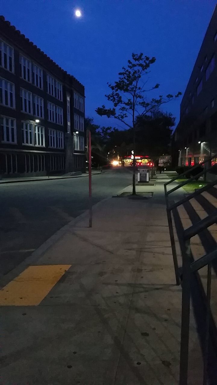 VIEW OF ILLUMINATED STREET LIGHTS AT NIGHT
