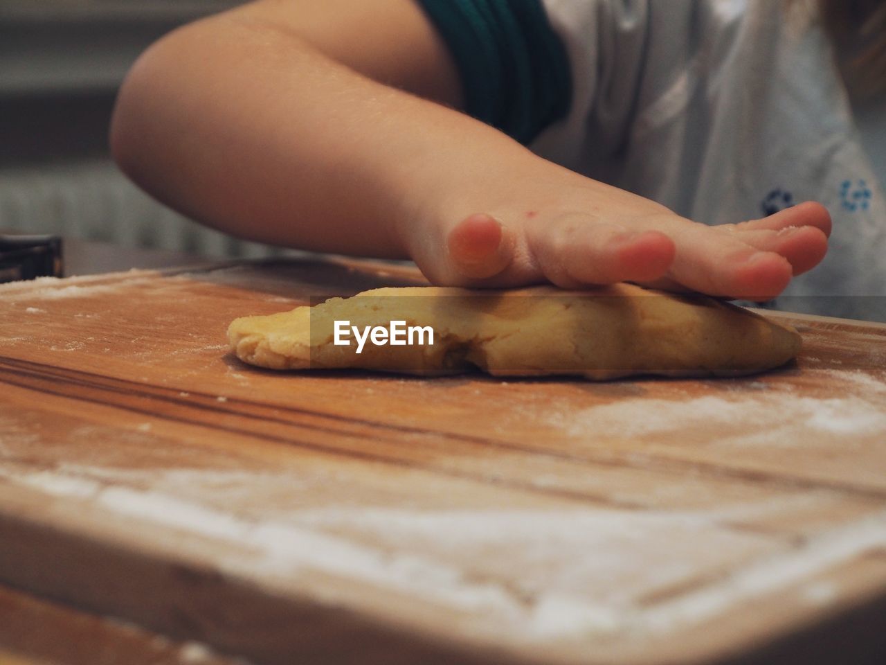 Close-up of person preparing food on cutting board