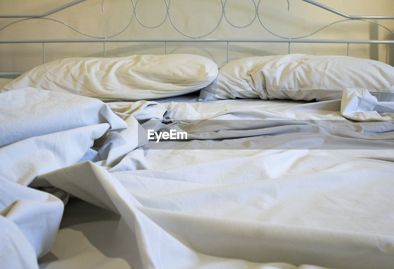 White sheet and pillows on bed