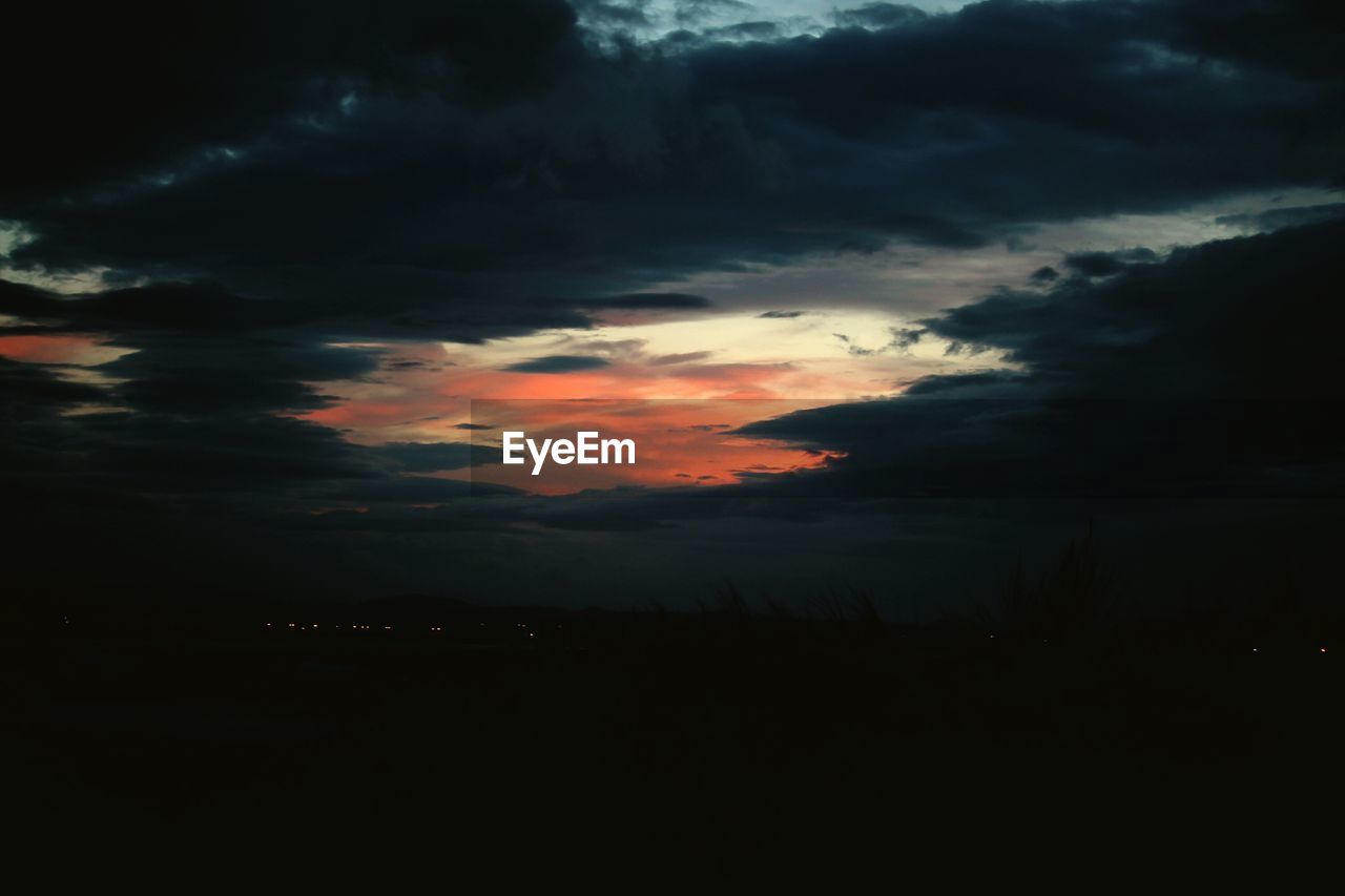 STORM CLOUDS OVER LANDSCAPE
