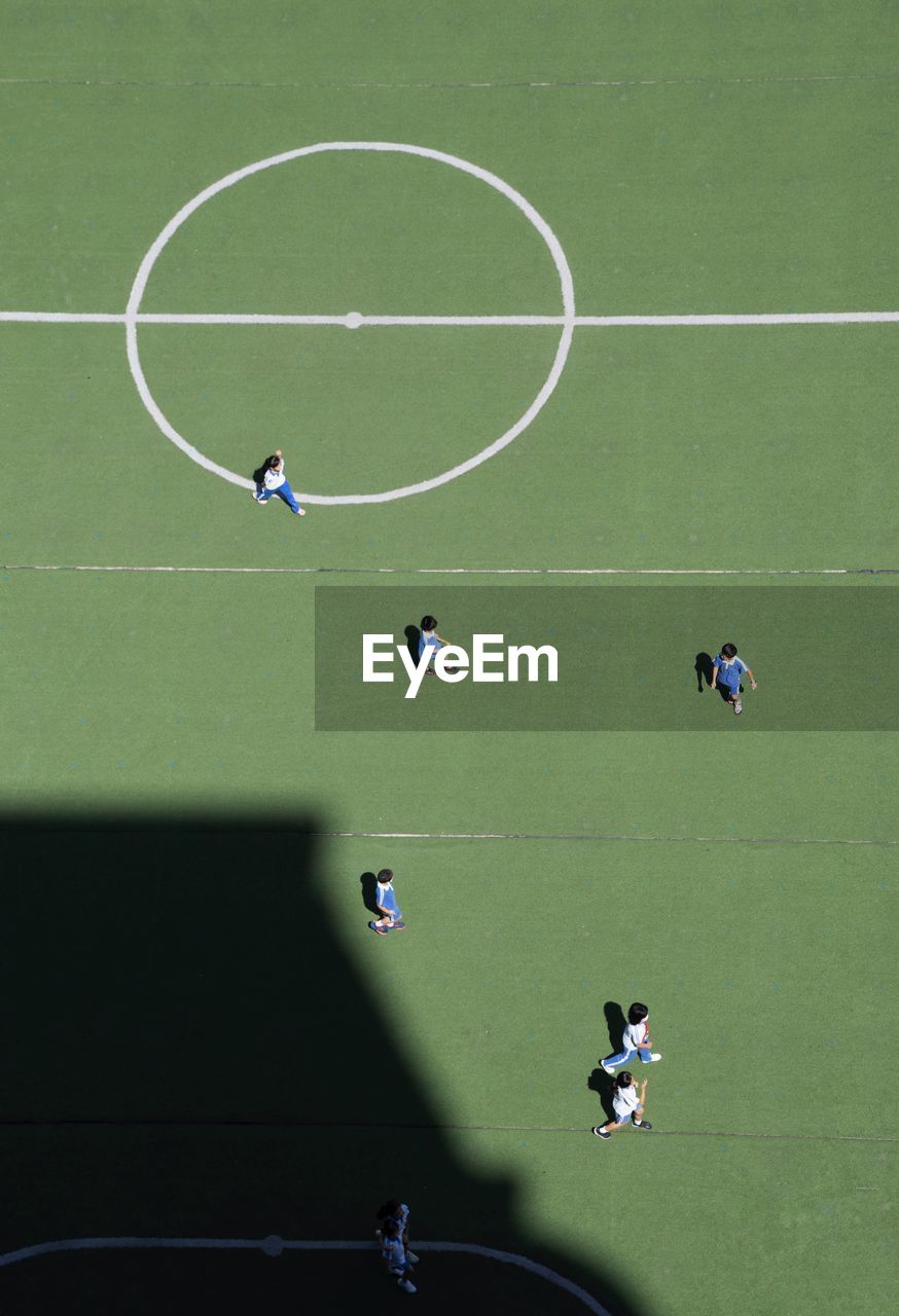 High angle view of people playing soccer on field
