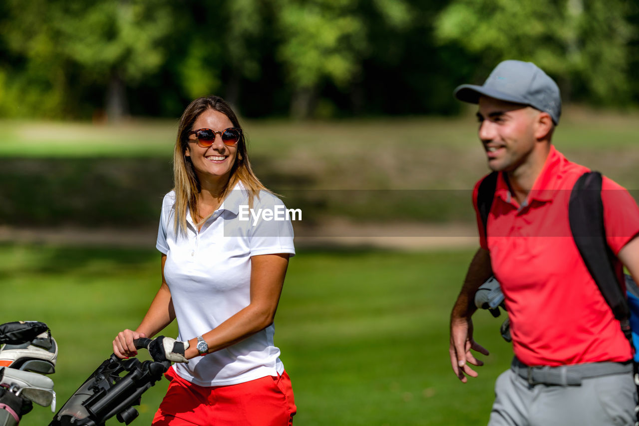 Golfing couple enjoying a game on a golf course