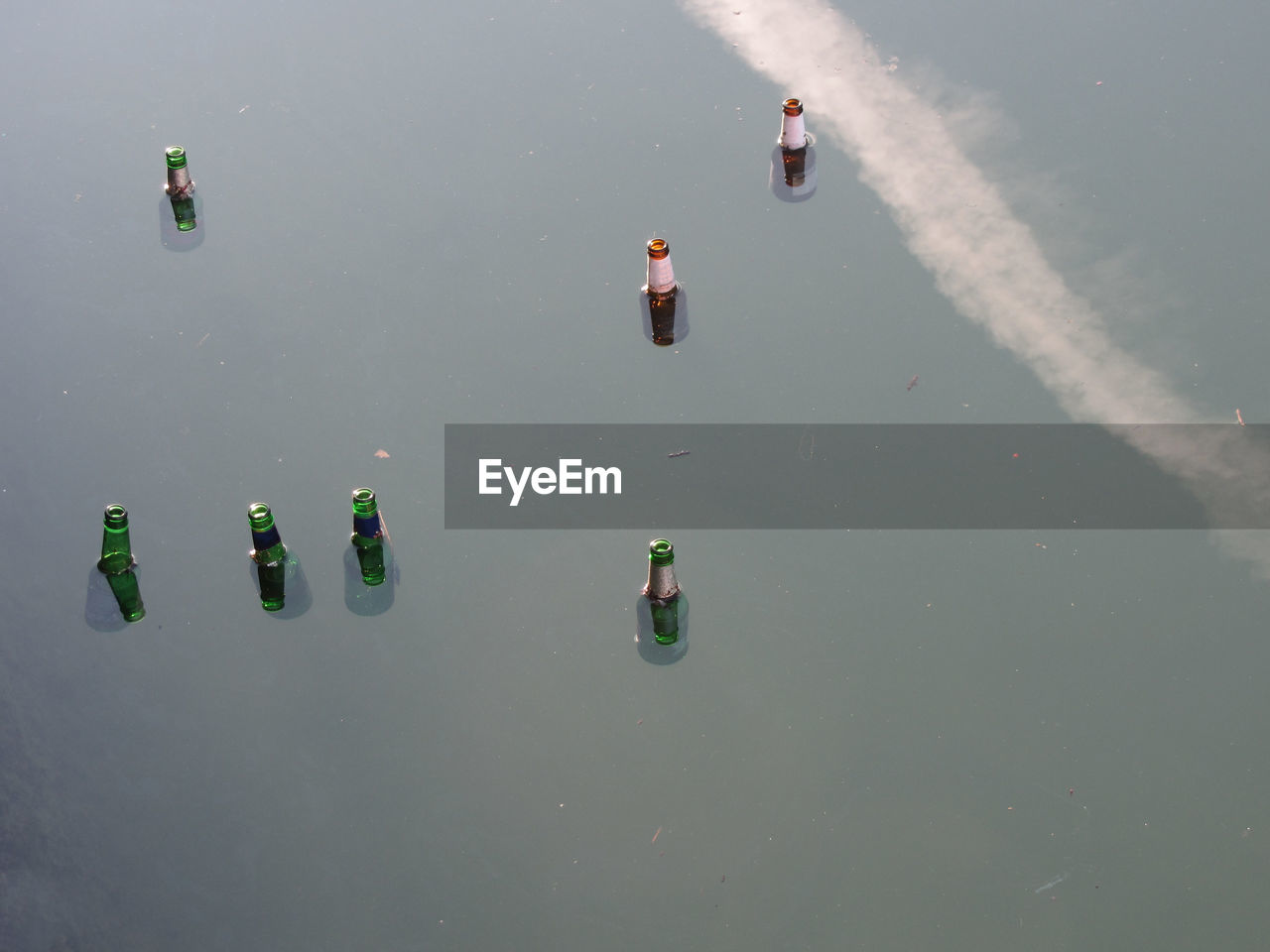 High angle view of bottles floating on water