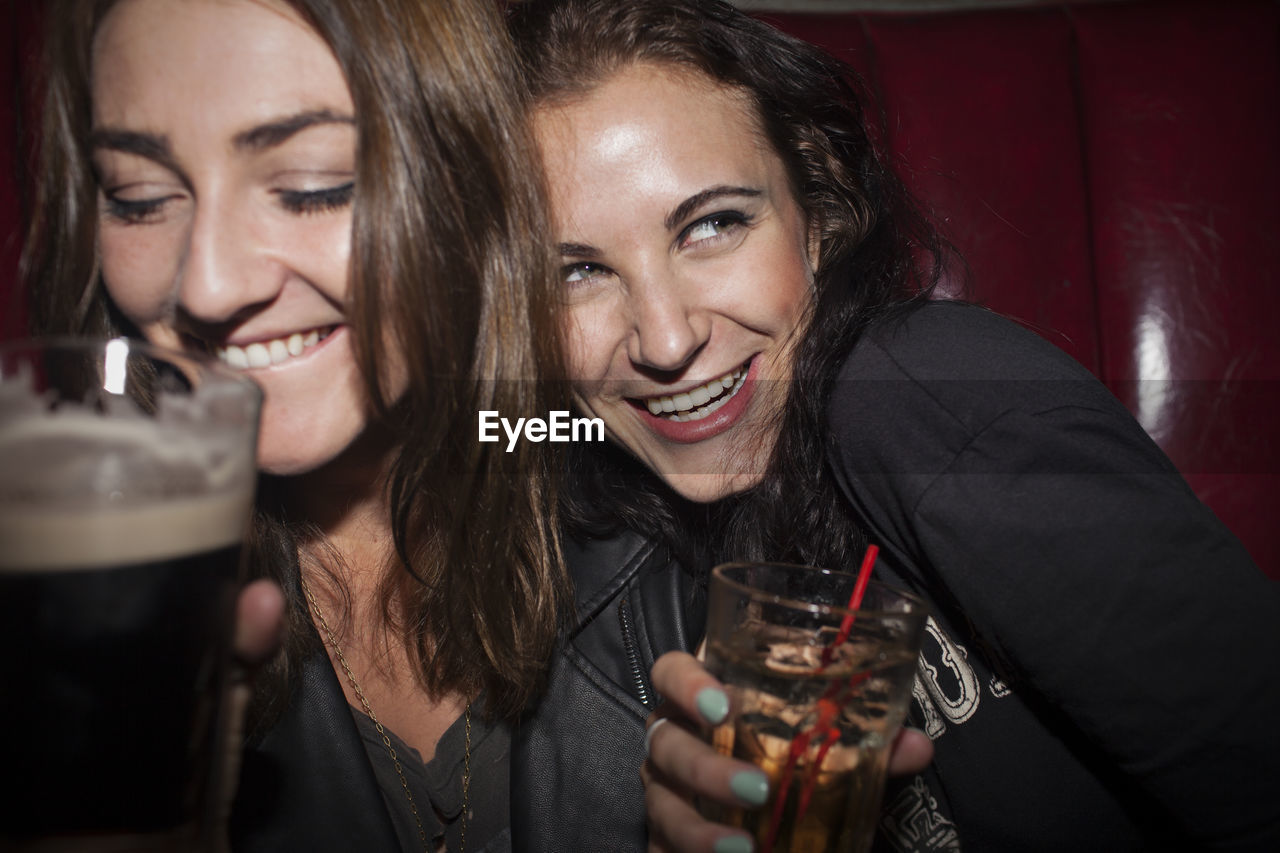 Two young women having drinks