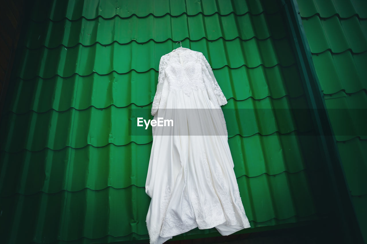 High anlge view of wedding dress on rooftop