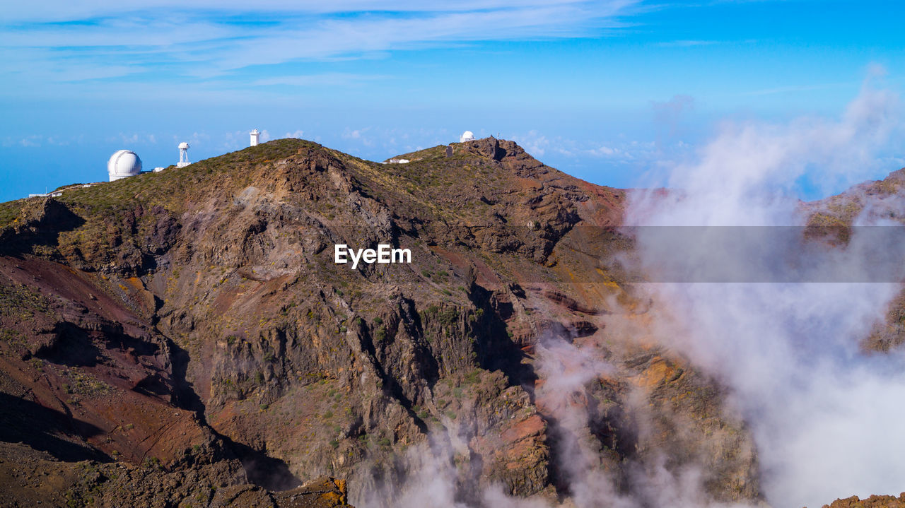 Panoramic mountain view of reflector and normal telescopes in canary islands 