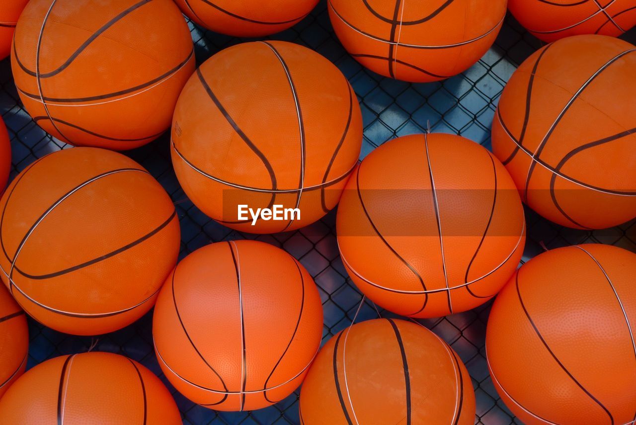 Full frame shot of basketballs on floor