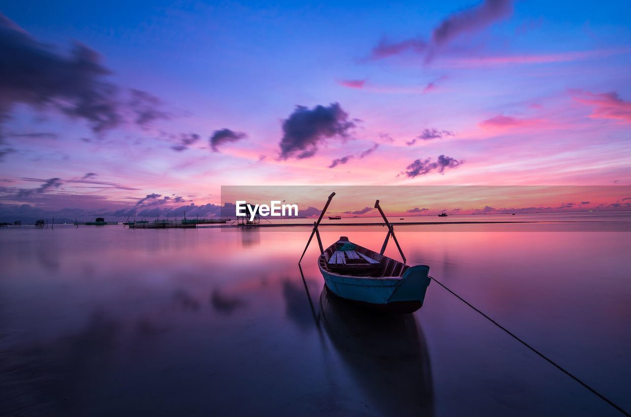water, sky, sunset, nautical vessel, reflection, sea, cloud, transportation, nature, beauty in nature, scenics - nature, tranquility, dawn, mode of transportation, travel, horizon, landscape, vehicle, tranquil scene, environment, twilight, evening, travel destinations, sun, boat, ocean, outdoors, fishing, blue, no people, idyllic, beach, pink, dramatic sky, land, seascape, afterglow, multi colored, lagoon, architecture, wave, horizon over water, holiday, tourism, moored, watercraft, shore, vacation