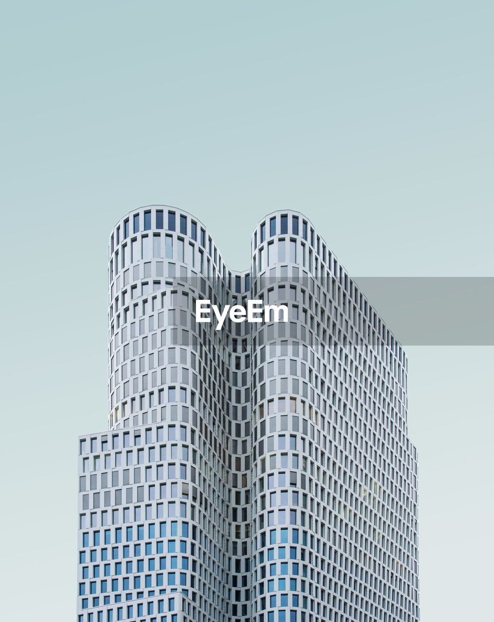 Low Angle View Of Modern Buildings Against Clear Sky On Eyeem