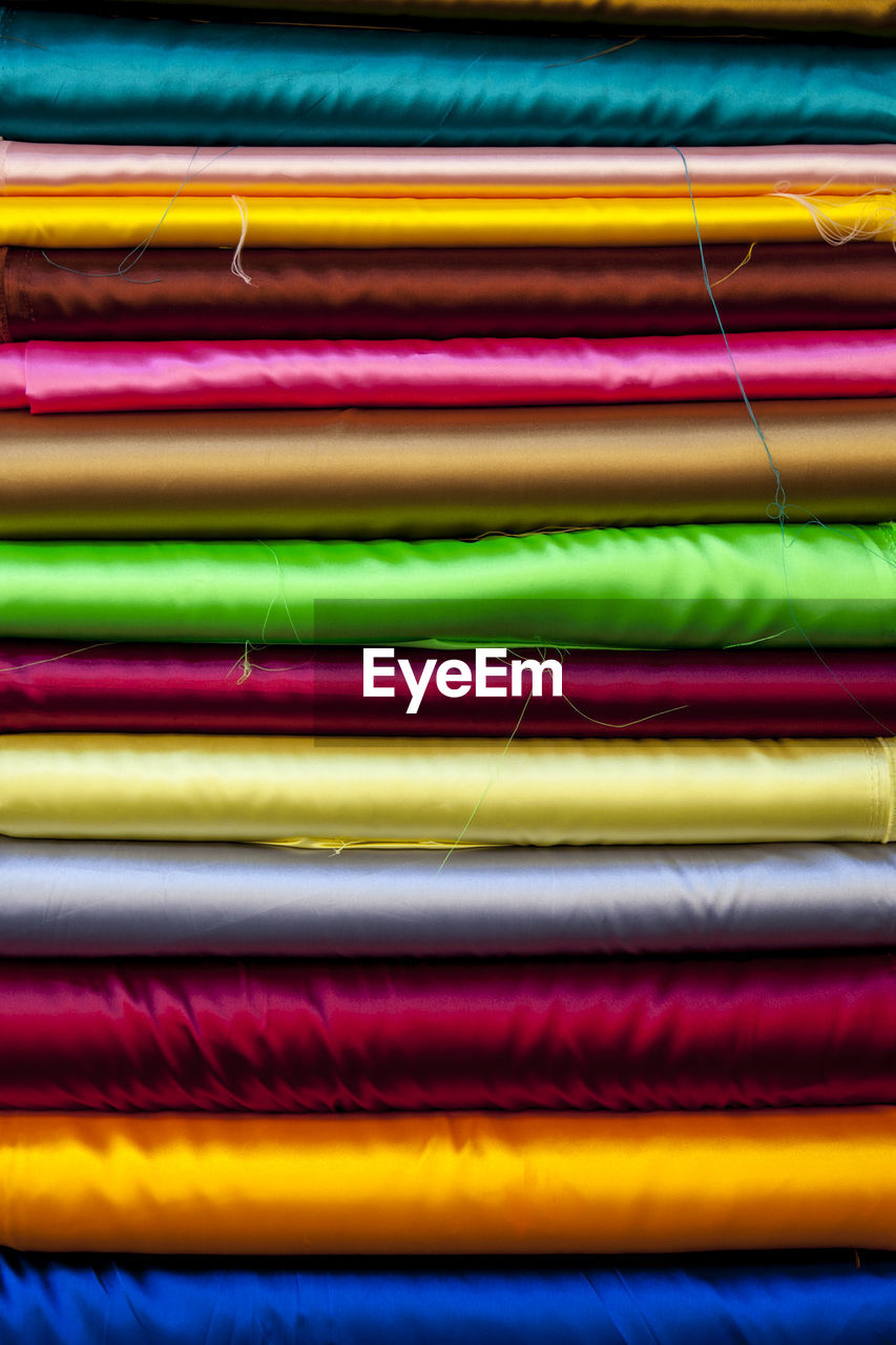 Variety of silk materials stacked on each other