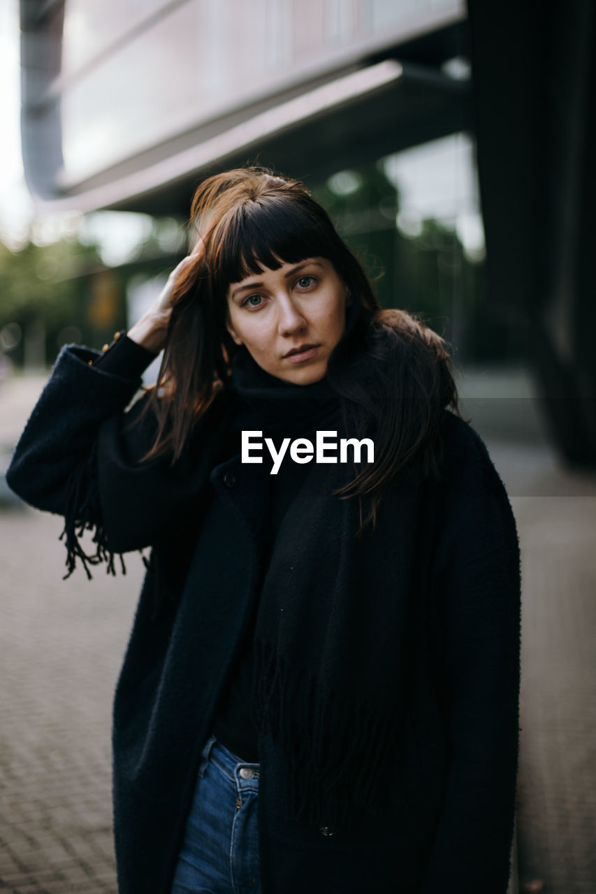 Portrait of a beautiful young woman on the street 