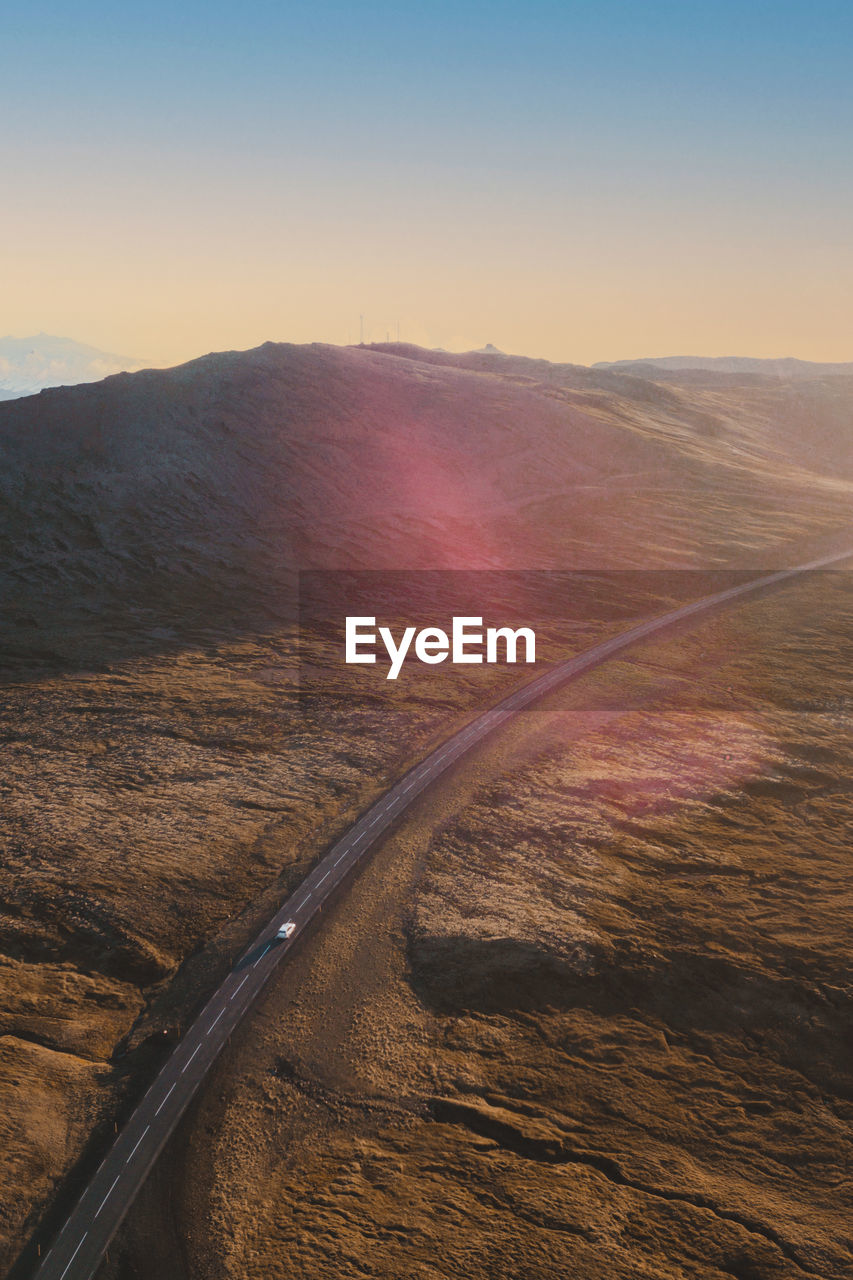 High angle view over scenic road in iceland with one car on the road