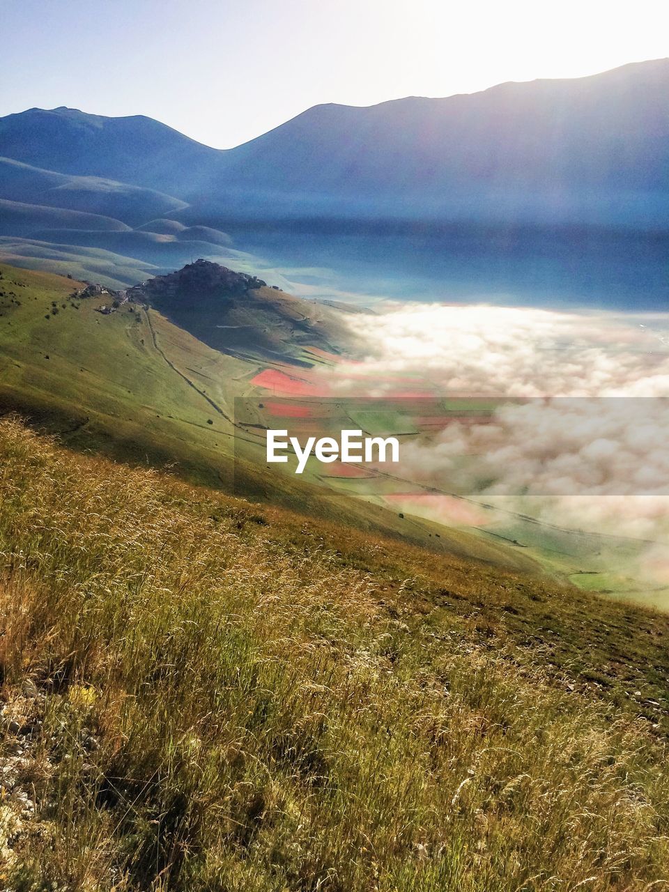Scenic landscape and mountains against clear sky