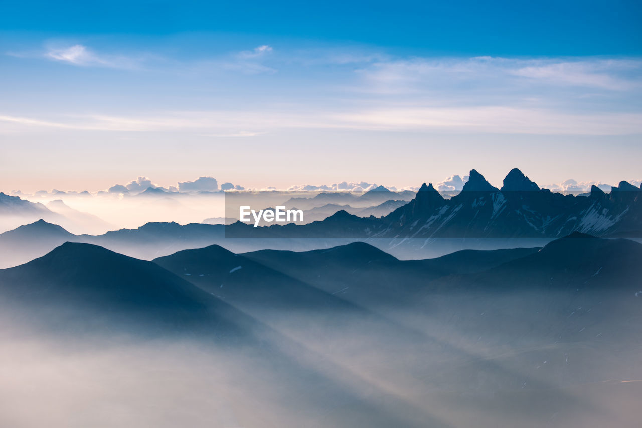 Scenic view of mountains against sky during sunset