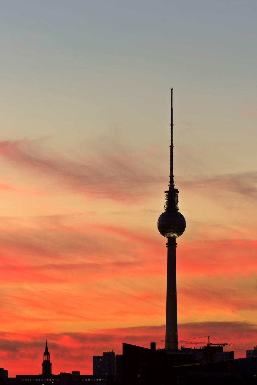 SILHOUETTE OF COMMUNICATIONS TOWER IN CITY