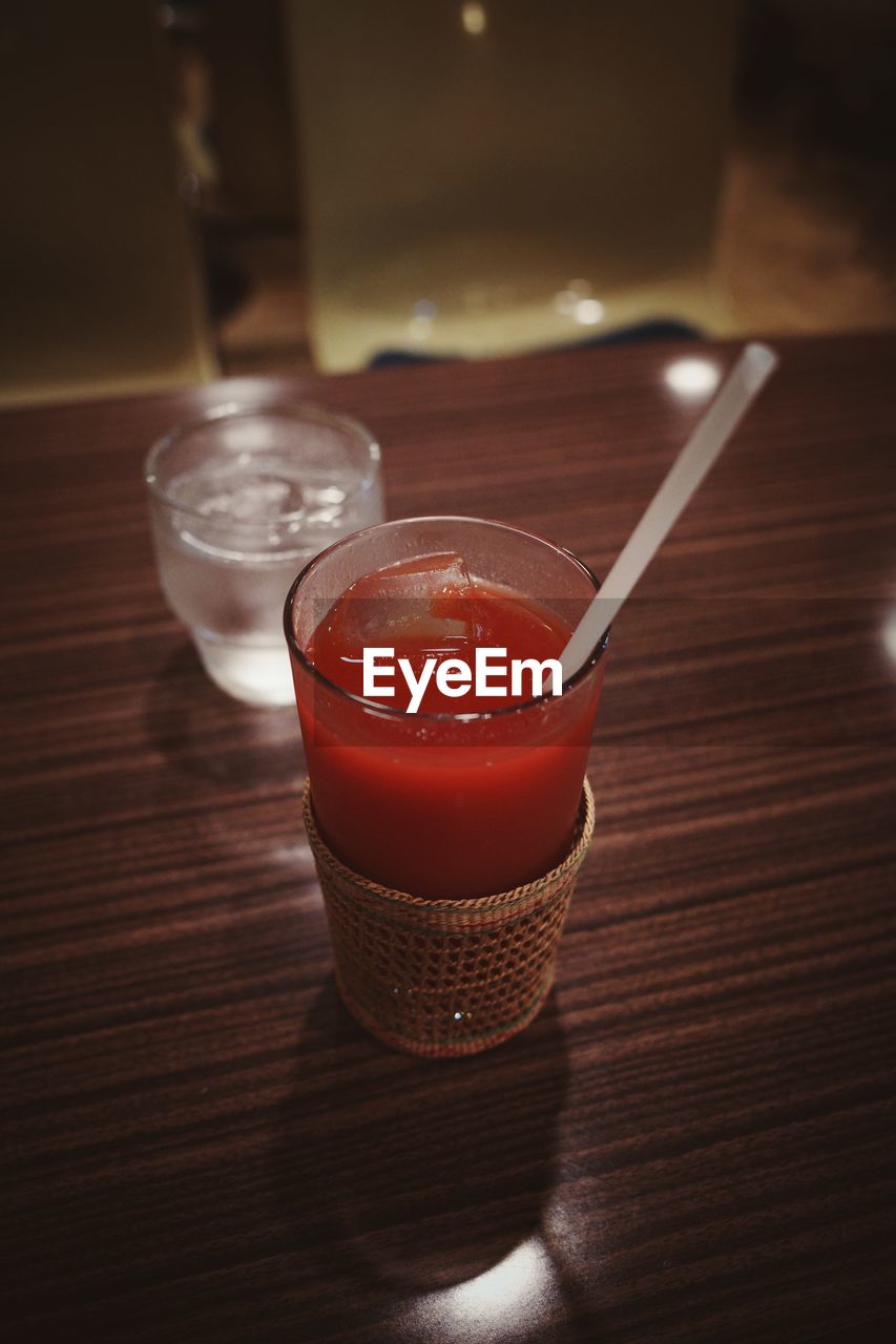 Close-up of tomato juice in glass on table