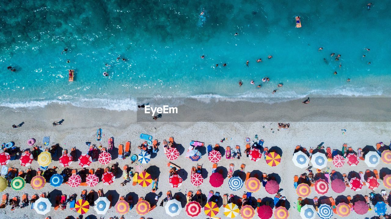 Aerial View Of Colorful Umbrellas On Shore At Beach On Eyeem