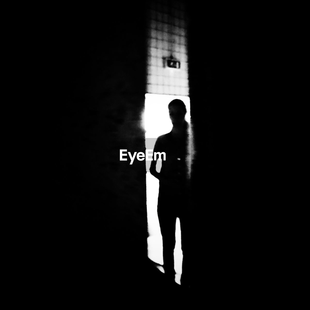 Woman in dark room