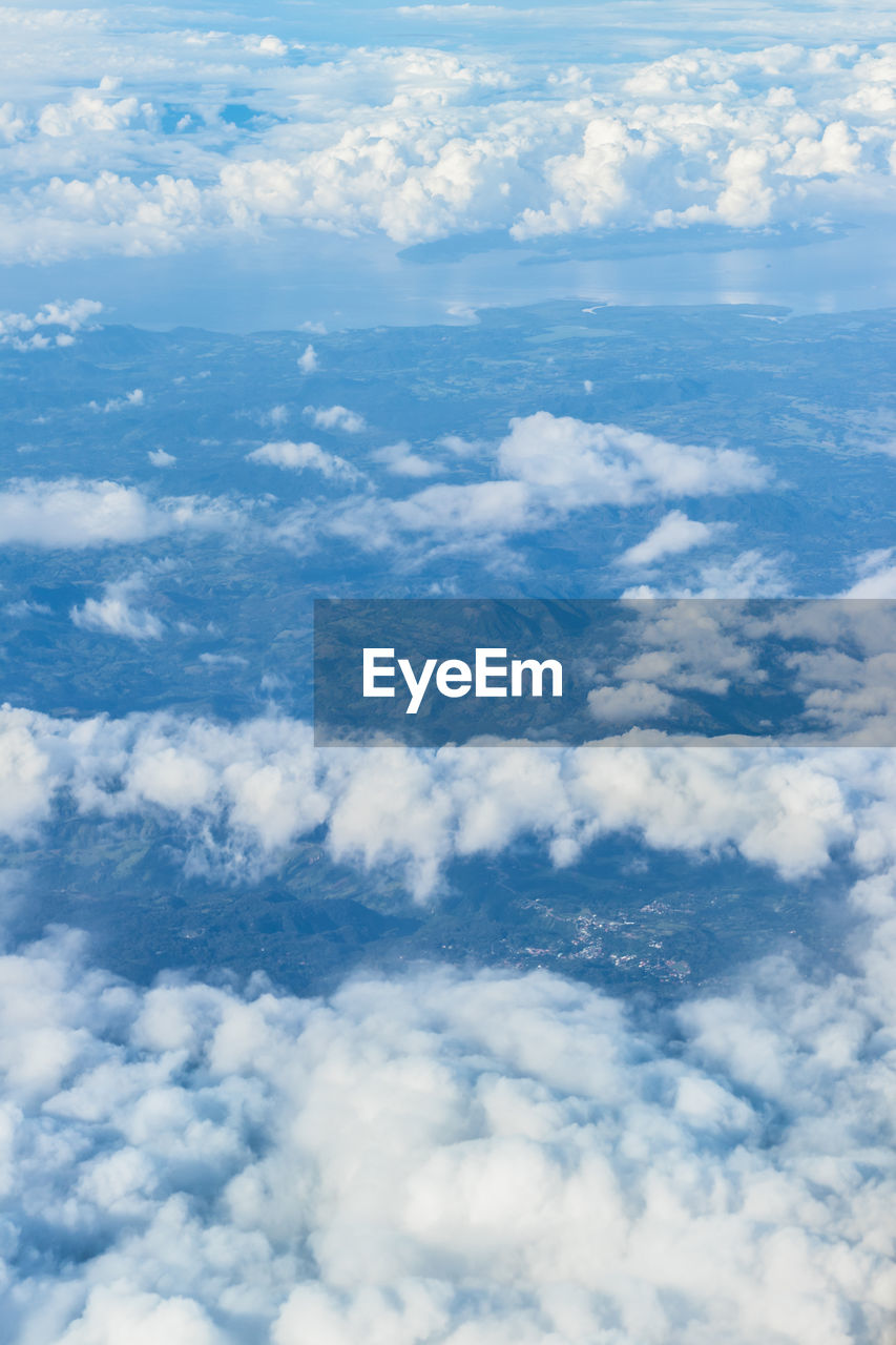 AERIAL VIEW OF CLOUDS OVER BLUE SKY
