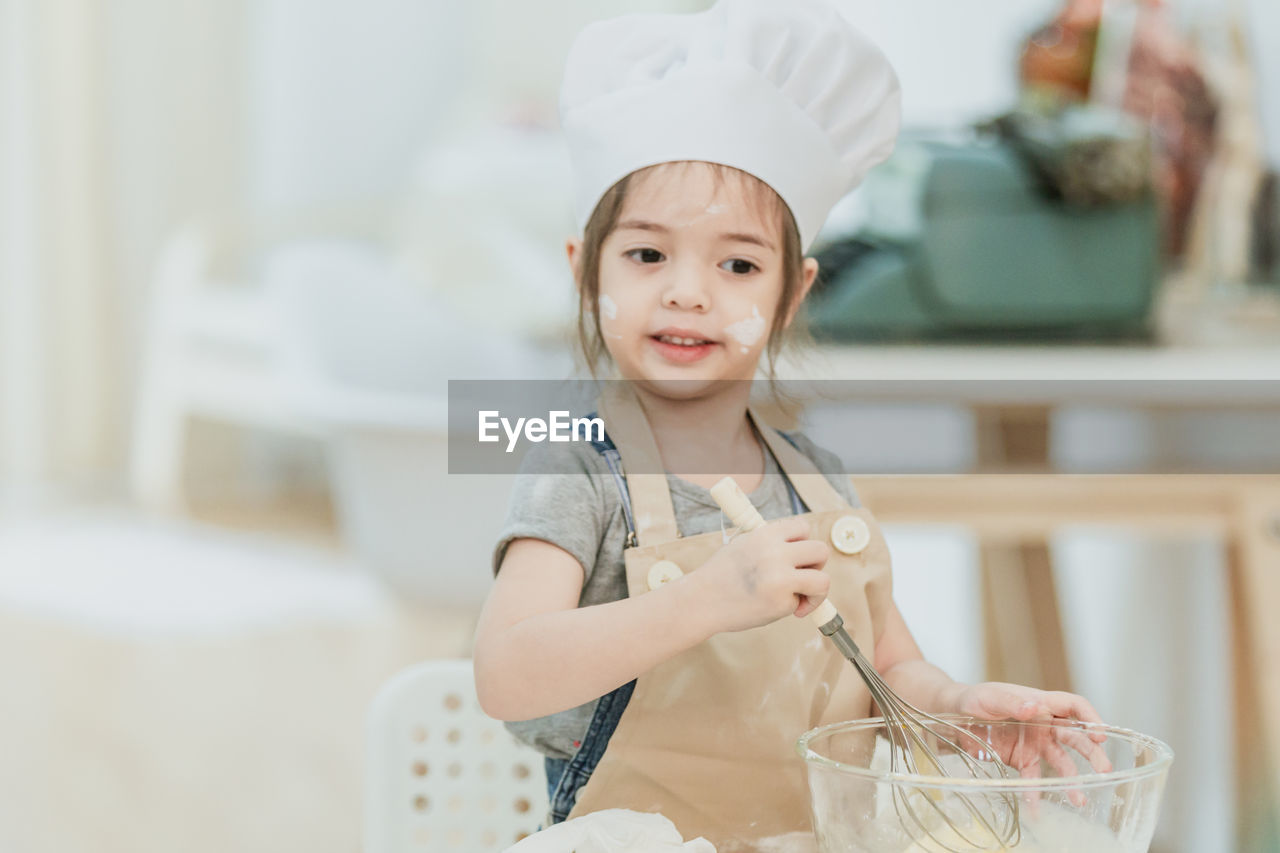 Girl preparing food in kitchen