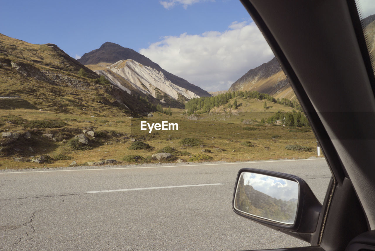 SCENIC VIEW OF MOUNTAINS SEEN THROUGH CAR