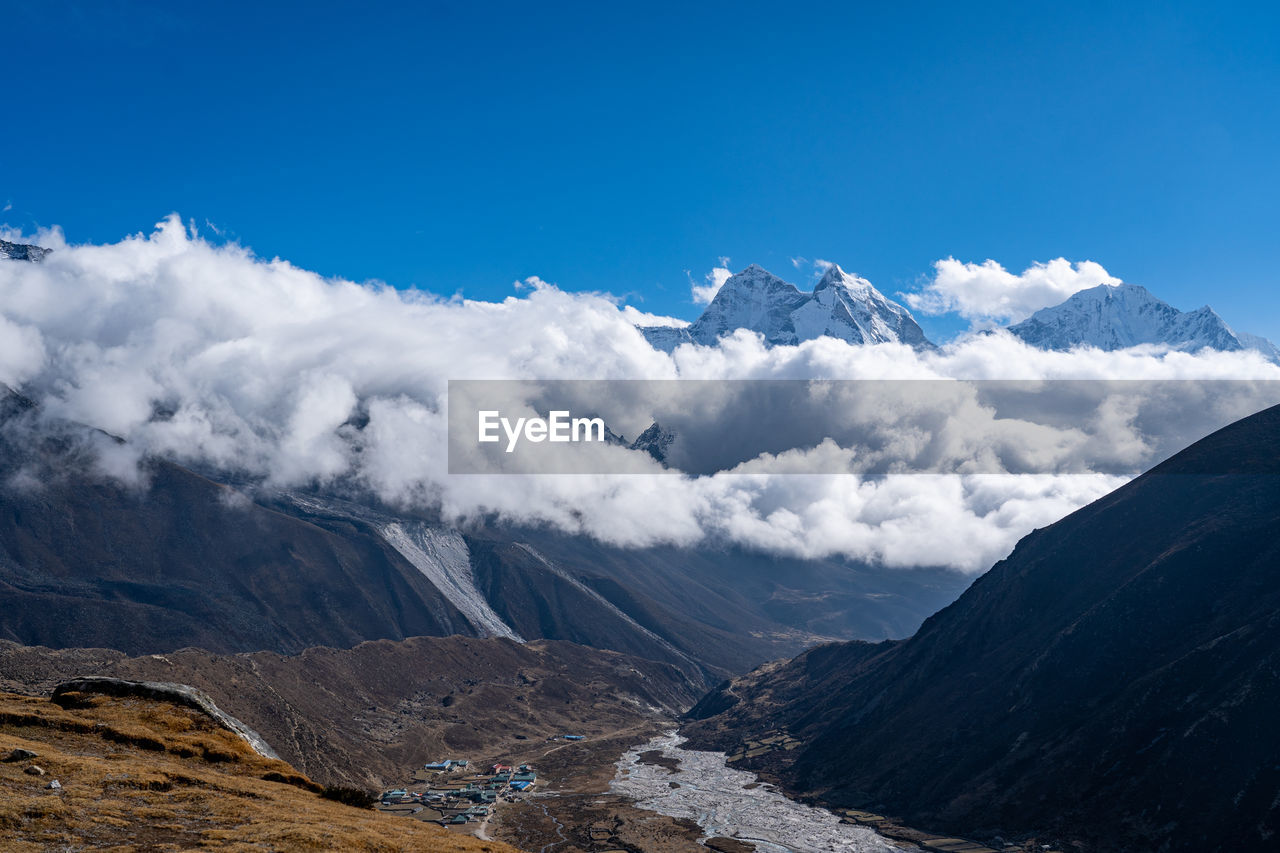 Scenic view of snowcapped mountains against sky