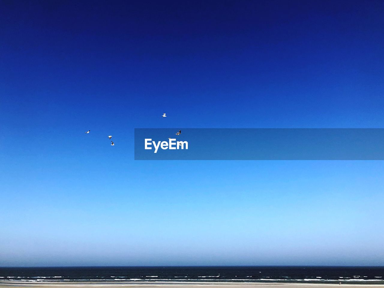 SCENIC VIEW OF BLUE SEA AGAINST CLEAR SKY