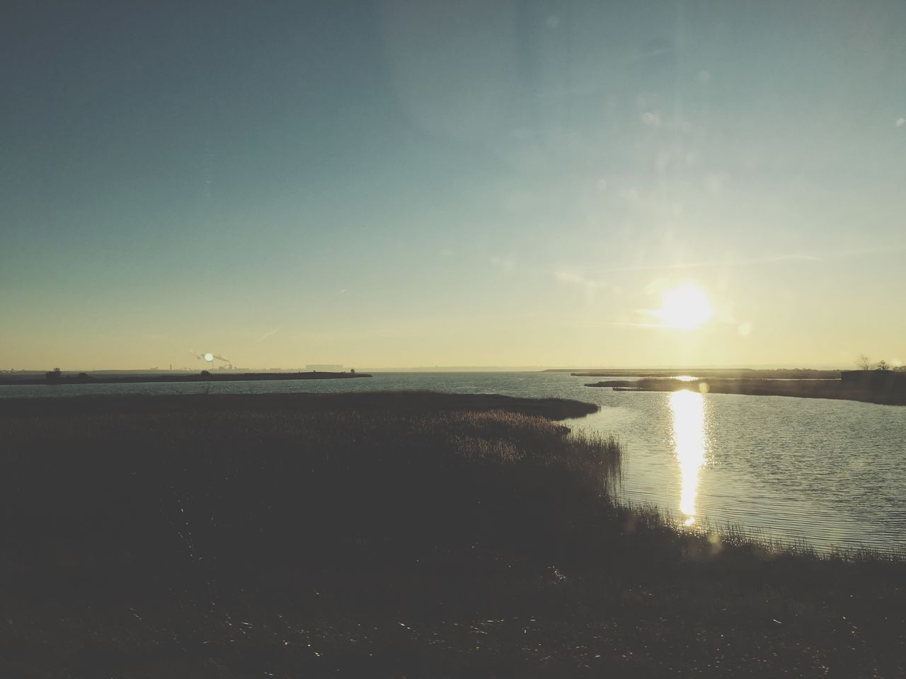 SCENIC VIEW OF SUNSET OVER SEA